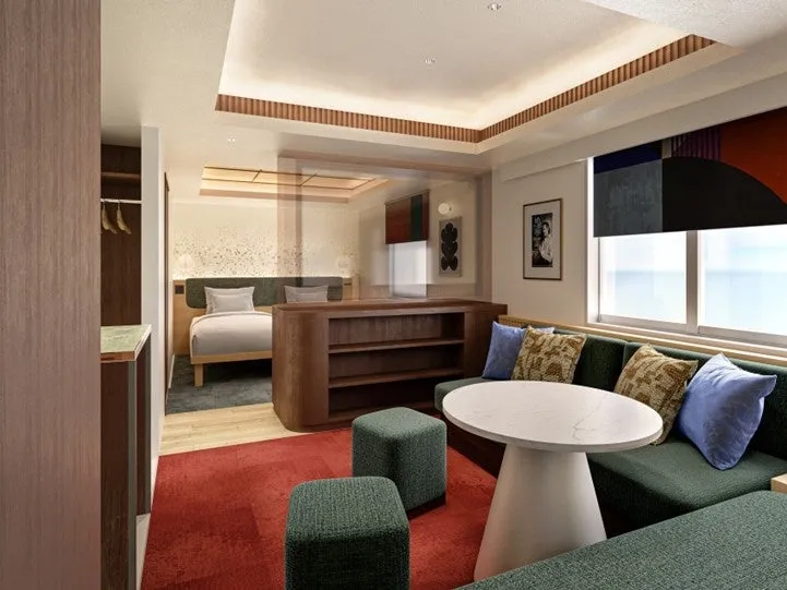 ゆったりとしたソファとテーブルを備えたスイートルーム