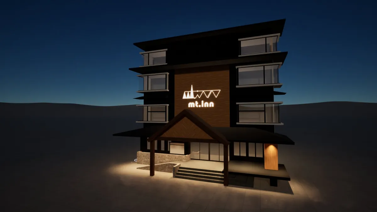 ライトアップされ、モダンなロゴが映えるmt. innの建物外観